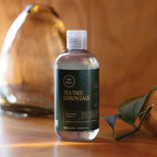 Paul Mitchell Tea Tree Lemon Sage Thickening Shampoo auf dem Tisch